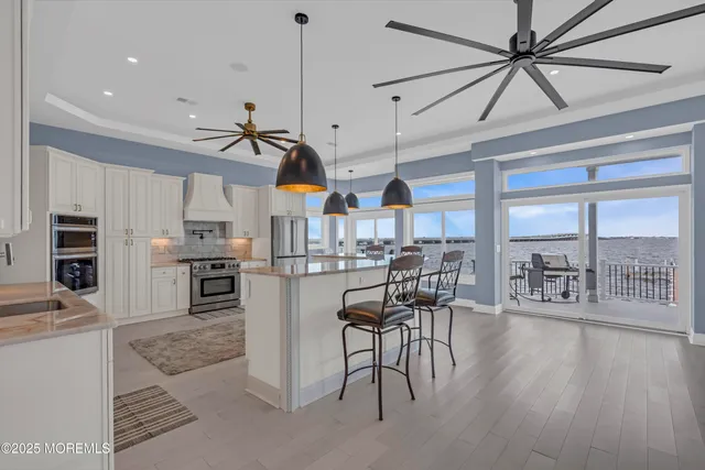 a bathroom with a granite countertop sink a toilet and a shower