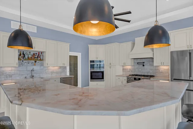 a bathroom with a granite countertop sink a toilet and a bathtub