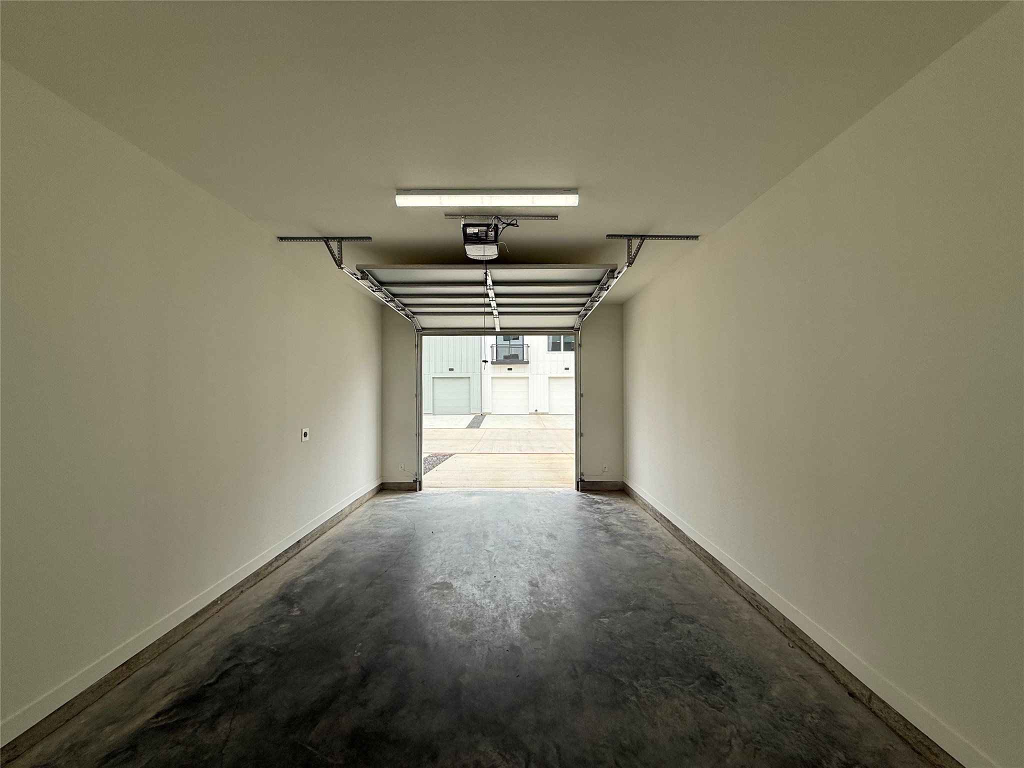1941 Sawdust Road, Unit 512 The Woodlands, TX 77380 - Photo 9 of 16 a view of a hallway with a window