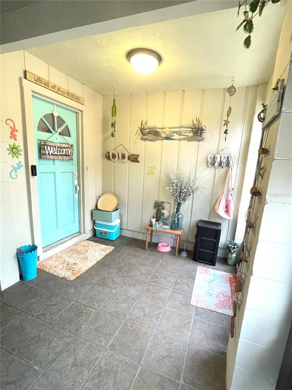 127 Cypress Pond Road Port Orange, FL 32128 - Photo 14 of 68 a living room with furniture and a floor to ceiling window