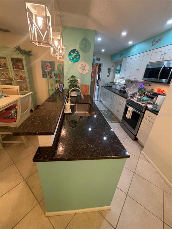 127 Cypress Pond Road Port Orange, FL 32128 - Photo 28 of 68 a room with furniture and a flat screen tv