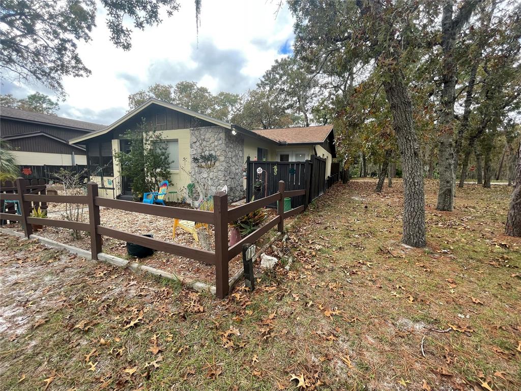 127 Cypress Pond Road Port Orange, FL 32128 - Photo 4 of 68 a view of a house with wooden fence