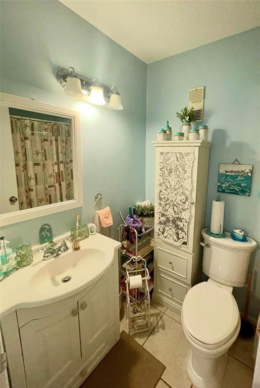 127 Cypress Pond Road Port Orange, FL 32128 - Photo 41 of 68 a bathroom with a toilet sink and mirror