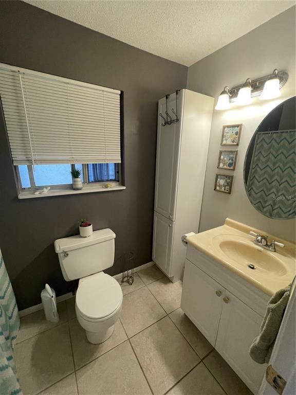 127 Cypress Pond Road Port Orange, FL 32128 - Photo 45 of 68 a bathroom with a toilet sink and mirror