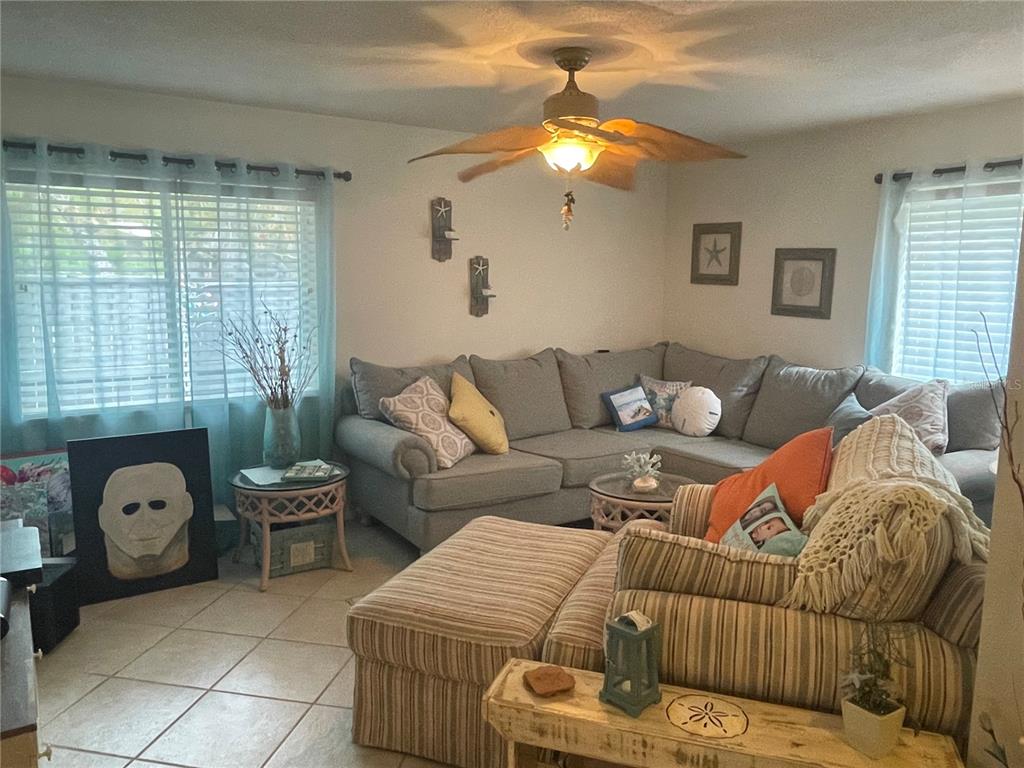 127 Cypress Pond Road Port Orange, FL 32128 - Photo 61 of 68 a living room with furniture and a large window