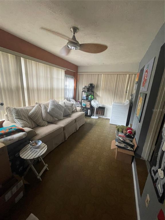 127 Cypress Pond Road Port Orange, FL 32128 - Photo 63 of 68 a living room with furniture and a large window