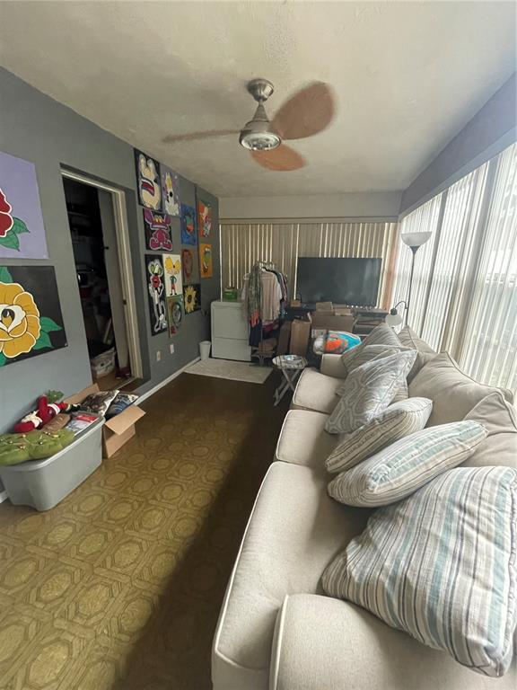 127 Cypress Pond Road Port Orange, FL 32128 - Photo 65 of 68 a living room with furniture and a flat screen tv