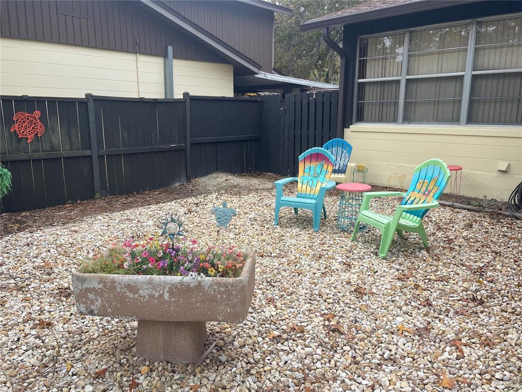 127 Cypress Pond Road Port Orange, FL 32128 - Photo 7 of 68 a wooden bench sitting in front of a building