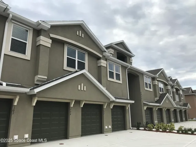 a front view of a house with a garage