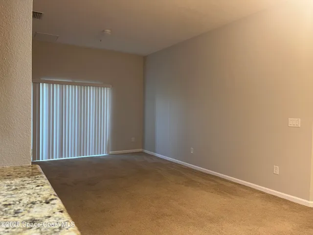 a view of a room with a balcony