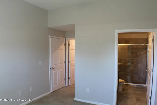 a view of a bathroom from a hallway