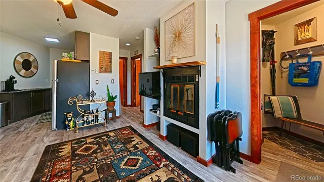 a kitchen with a sink a refrigerator and a stove