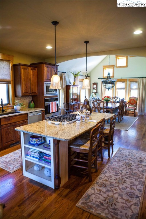 138 South Camp Road, Unit 104 Boone, NC 28607 - Photo 11 of 33 a kitchen with stainless steel appliances granite countertop a stove and a wooden floors