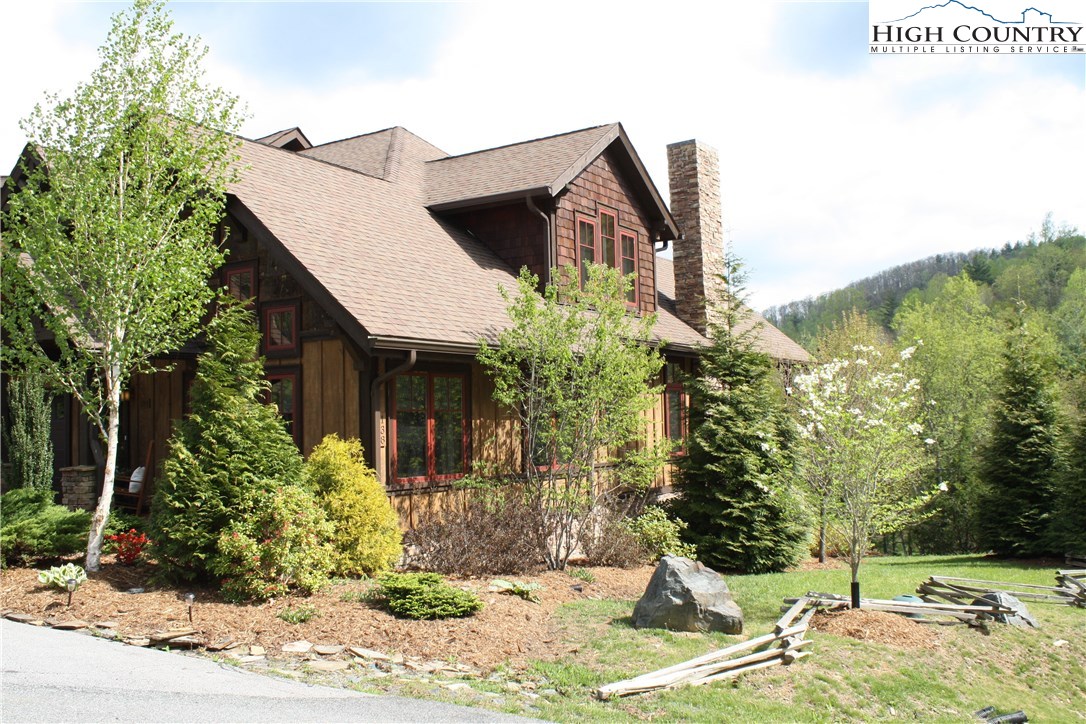 138 South Camp Road, Unit 104 Boone, NC 28607 - Photo 5 of 33 a view of a house with backyard and sitting area