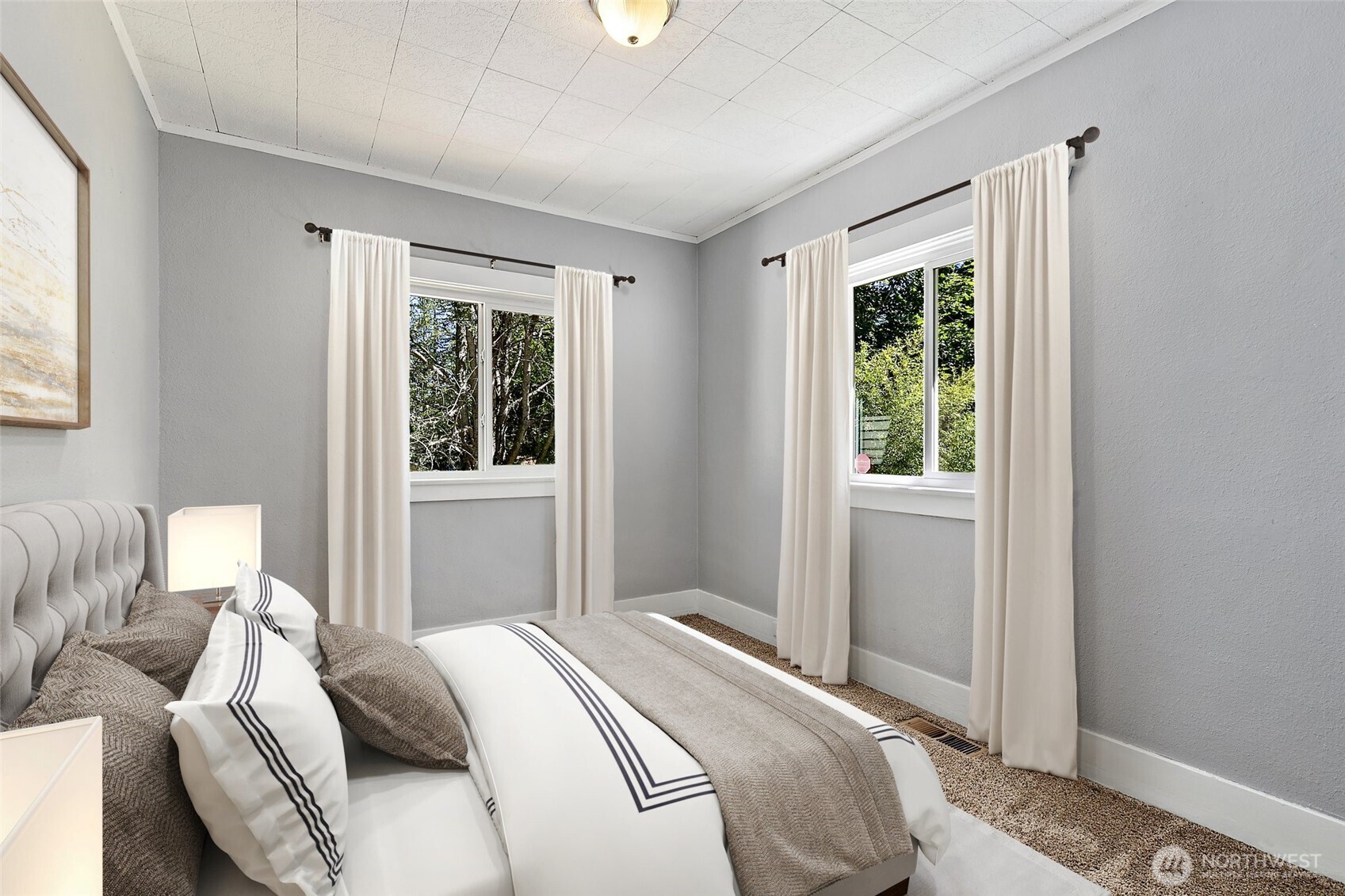 9880 Fredrickson Road Northwest Bremerton, WA 98311 - Photo 12 of 28 a bedroom with a bed and a window