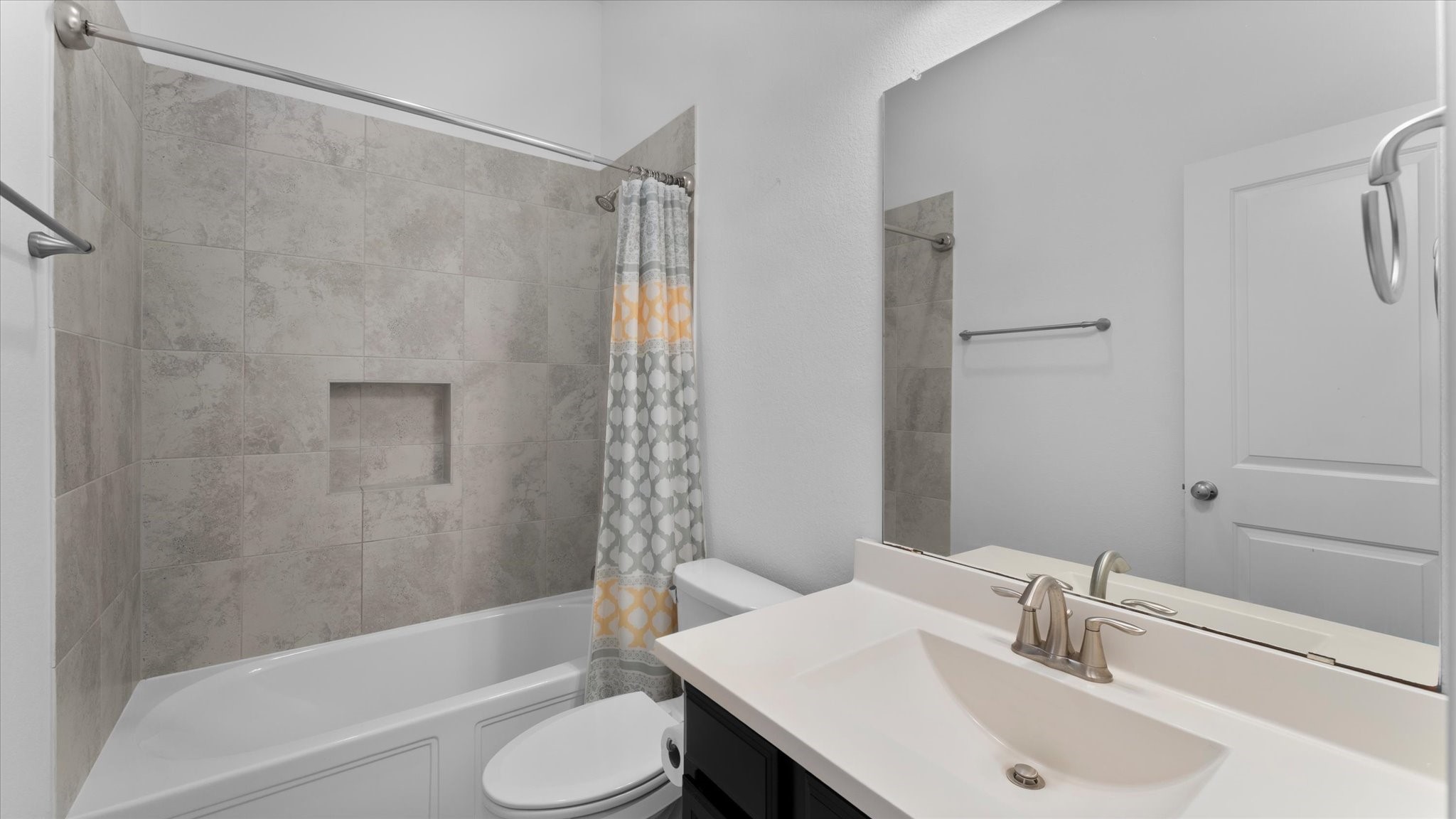32001 Birch Briar Court Spring, TX 77386 - Photo 36 of 48 Well-appointed full bathroom featuring granite countertops, modern fixtures, and a beautifully tiled tub and shower combination.