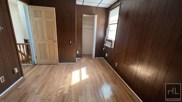 a view of gallery with wooden floor