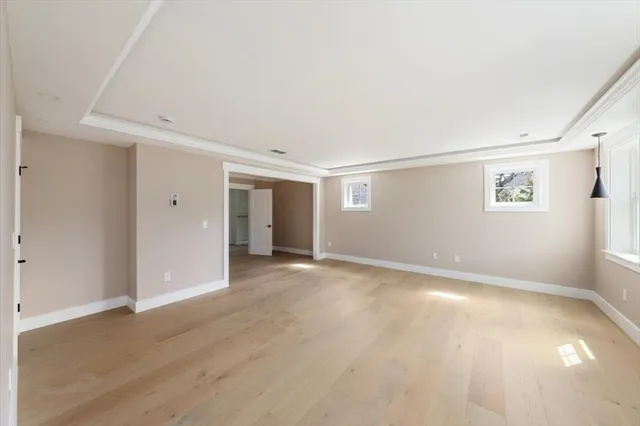 an empty room with windows and closet