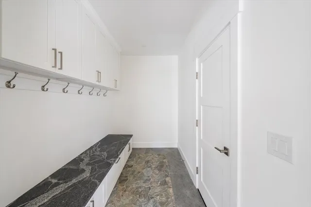 a view of a hallway with staircase