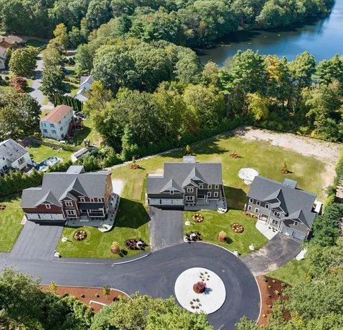 an aerial view of a house with swimming pool outdoor seating and yard