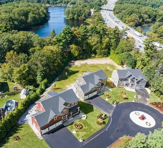 an aerial view of a house with a swimming pool