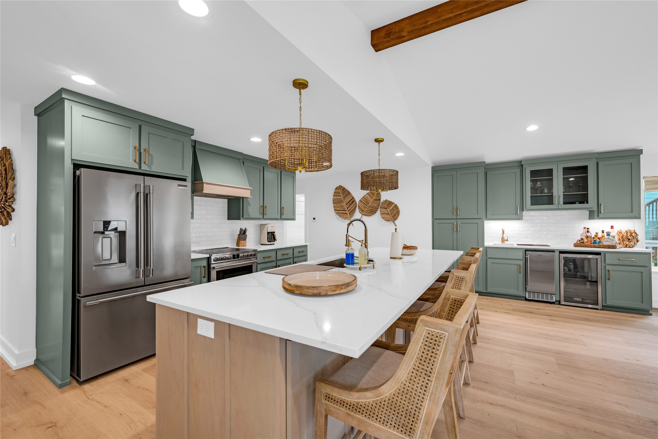 2477 Gilmore Crystal Beach, TX 77650 - Photo 13 of 40 a kitchen with stainless steel appliances kitchen island granite countertop a dining table and chairs