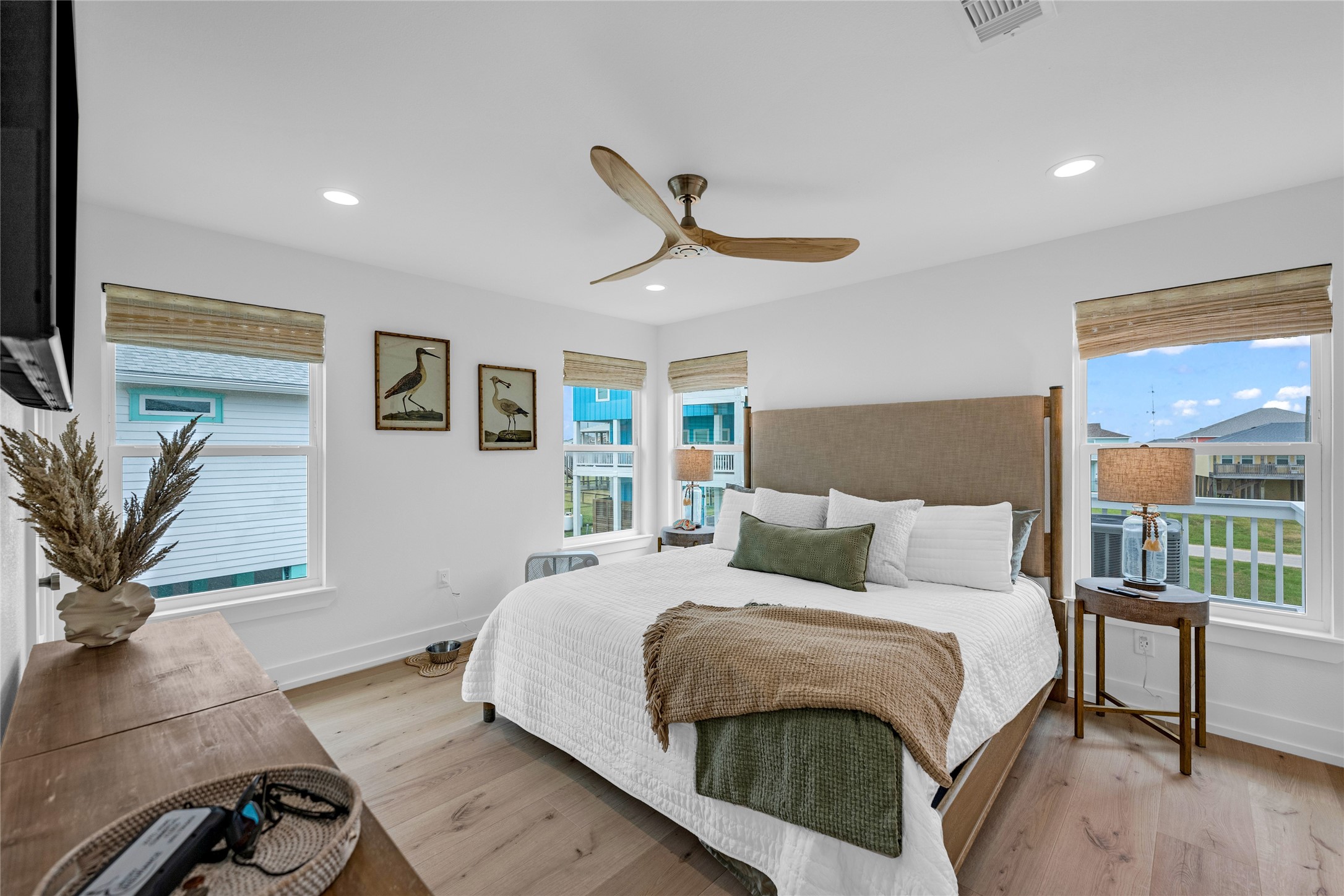 2477 Gilmore Crystal Beach, TX 77650 - Photo 18 of 40 a bedroom with a large bed and a chandelier