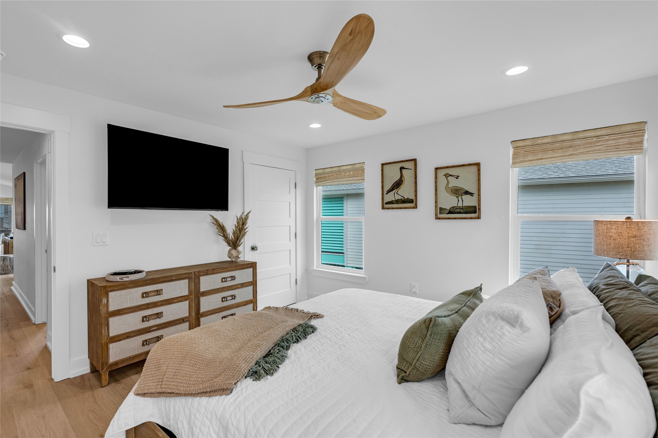 2477 Gilmore Crystal Beach, TX 77650 - Photo 19 of 40 a bedroom with a bed and a flat screen tv