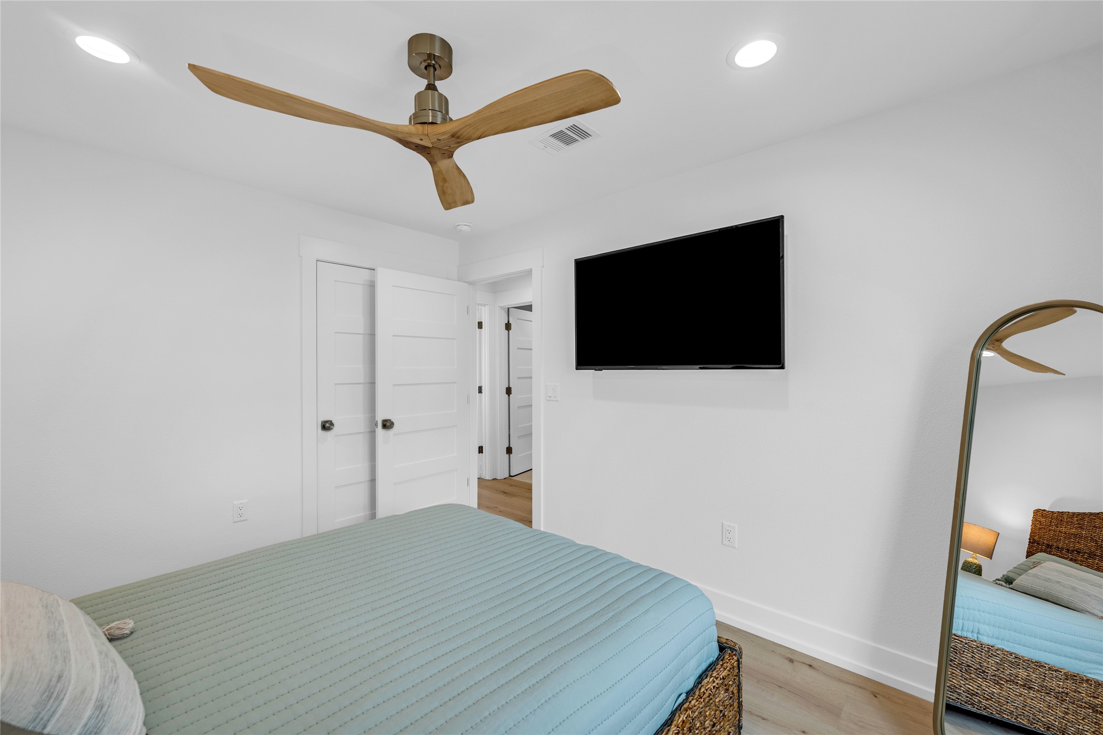 2477 Gilmore Crystal Beach, TX 77650 - Photo 23 of 40 a bedroom with a bed and a flat screen tv