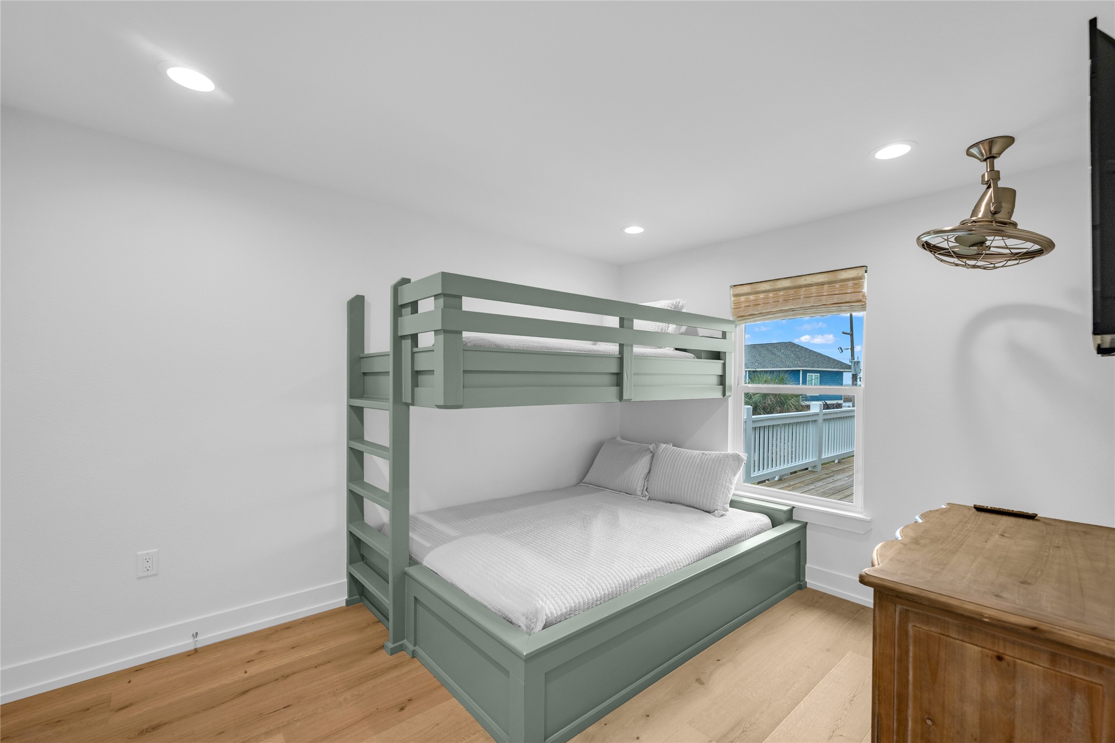 2477 Gilmore Crystal Beach, TX 77650 - Photo 26 of 40 a bedroom with a bed and a table