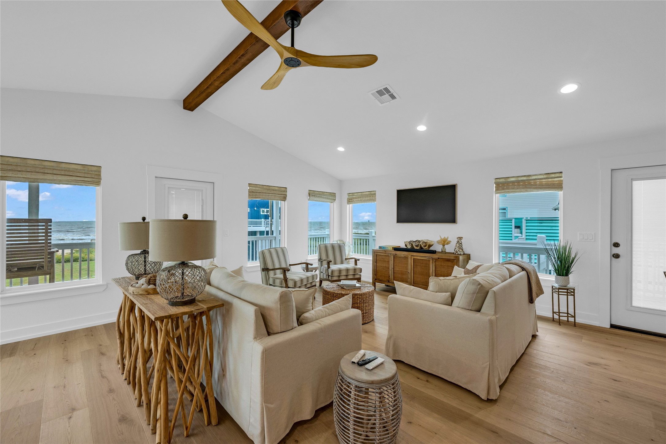 2477 Gilmore Crystal Beach, TX 77650 - Photo 8 of 40 a living room with furniture and a flat screen tv with wooden floor