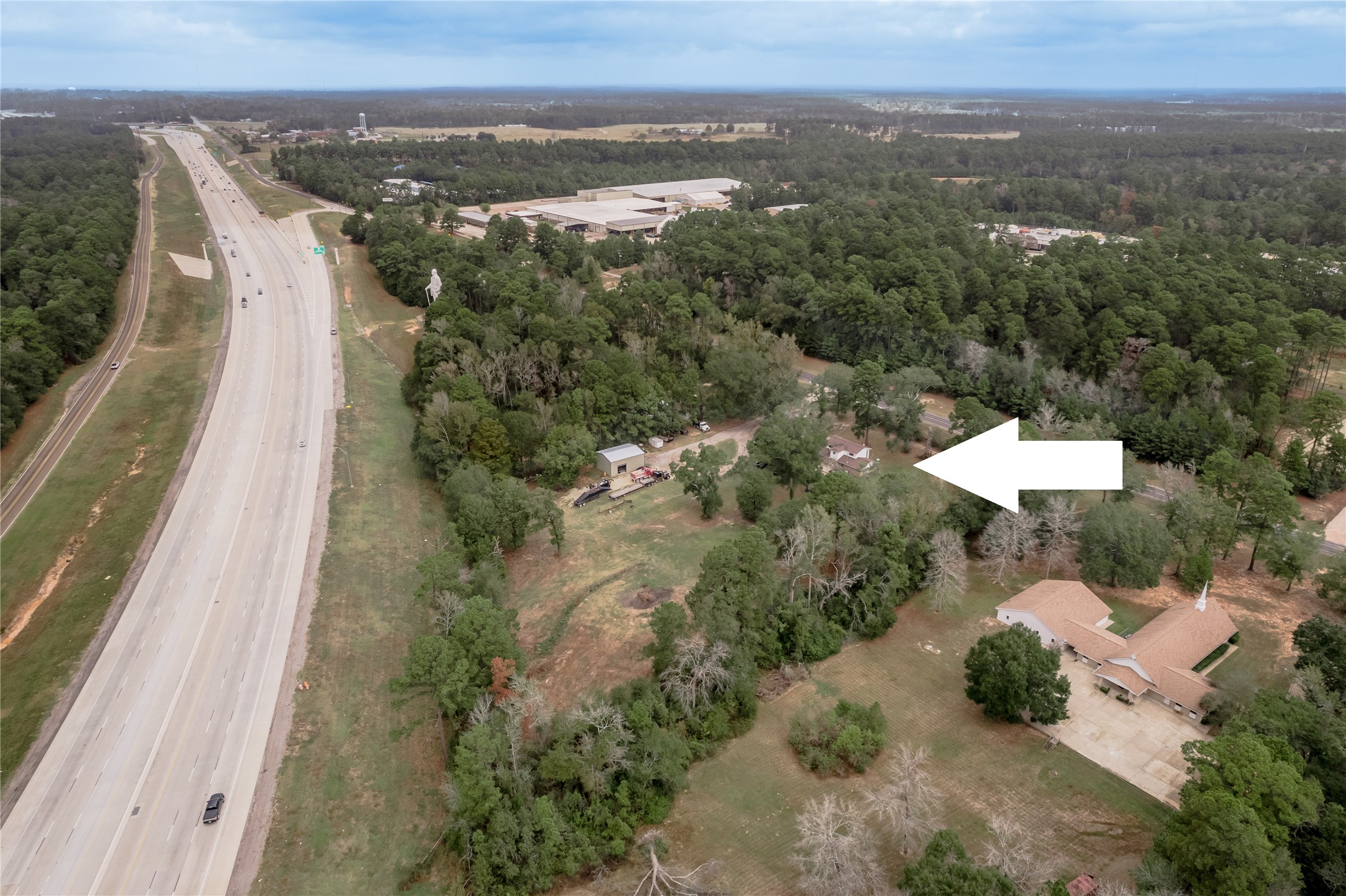 7640 Highway 75 Huntsville, TX 77340 - Photo 14 of 49 an aerial view of a house with a yard