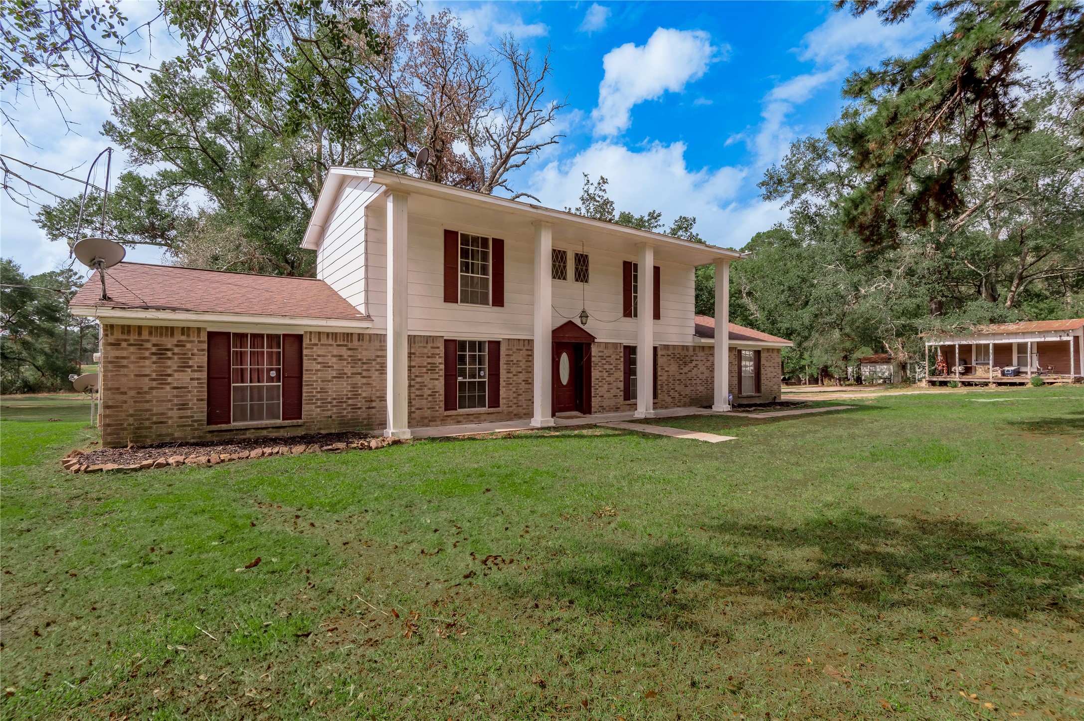 7640 Highway 75 Huntsville, TX 77340 - Photo 2 of 49 a view of a house with a backyard