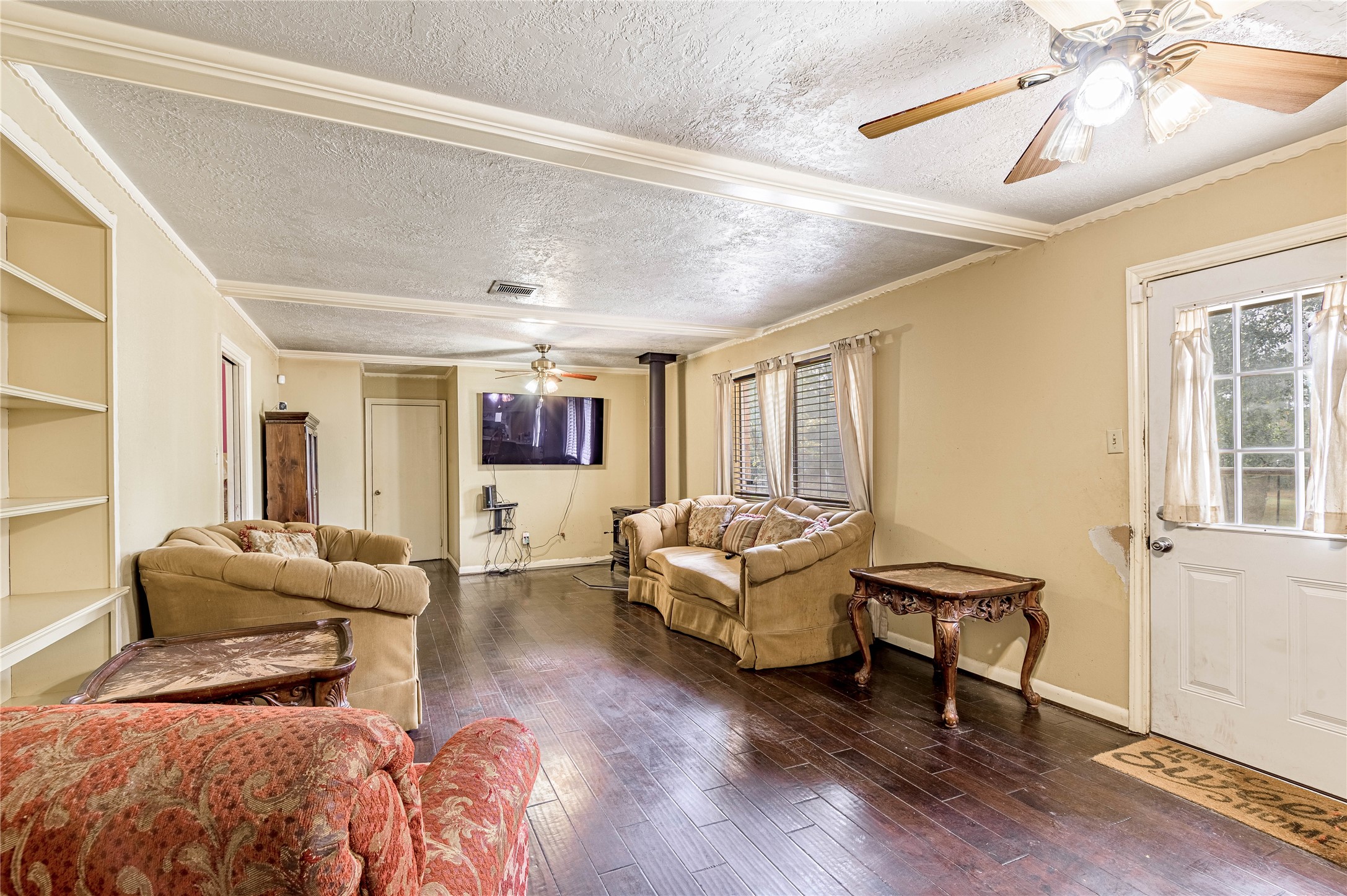 7640 Highway 75 Huntsville, TX 77340 - Photo 36 of 49 a living room with furniture and wooden floor