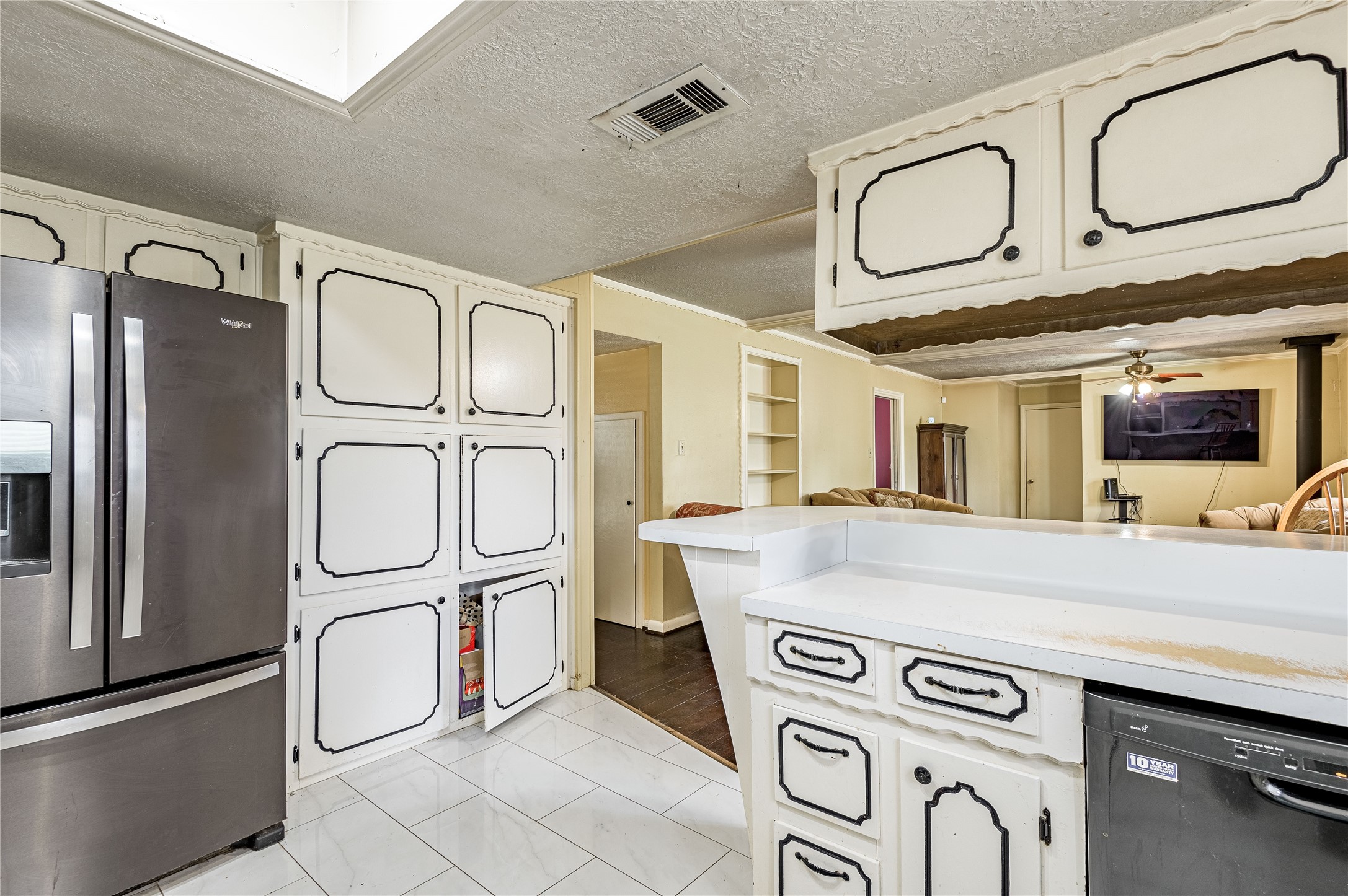 7640 Highway 75 Huntsville, TX 77340 - Photo 37 of 49 a kitchen with stainless steel appliances granite countertop a sink and a refrigerator