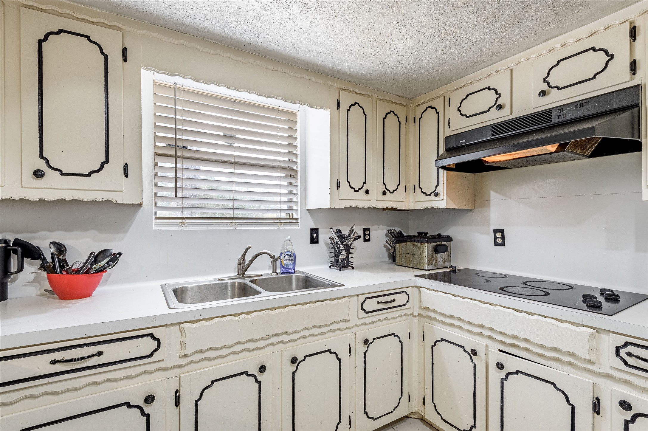 7640 Highway 75 Huntsville, TX 77340 - Photo 38 of 49 a kitchen with stainless steel appliances granite countertop a sink and cabinets