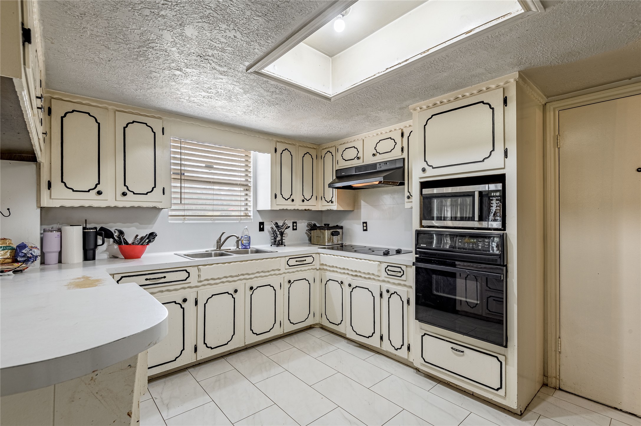 7640 Highway 75 Huntsville, TX 77340 - Photo 40 of 49 a kitchen with stainless steel appliances granite countertop a sink and cabinets