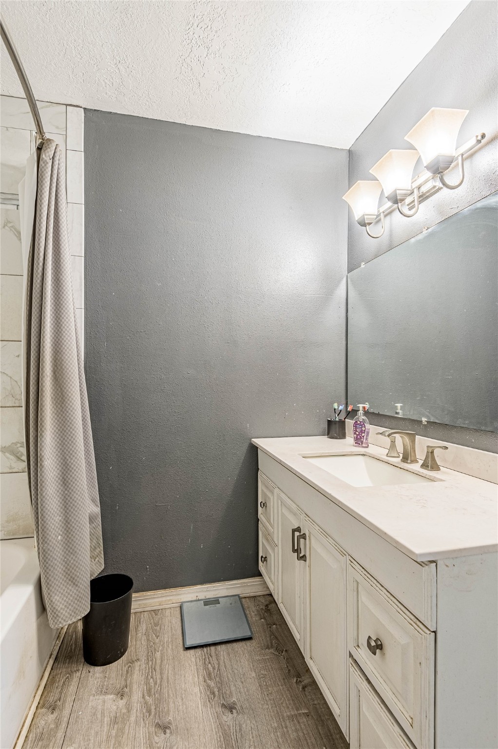 7640 Highway 75 Huntsville, TX 77340 - Photo 47 of 49 a bathroom with a sink and a mirror