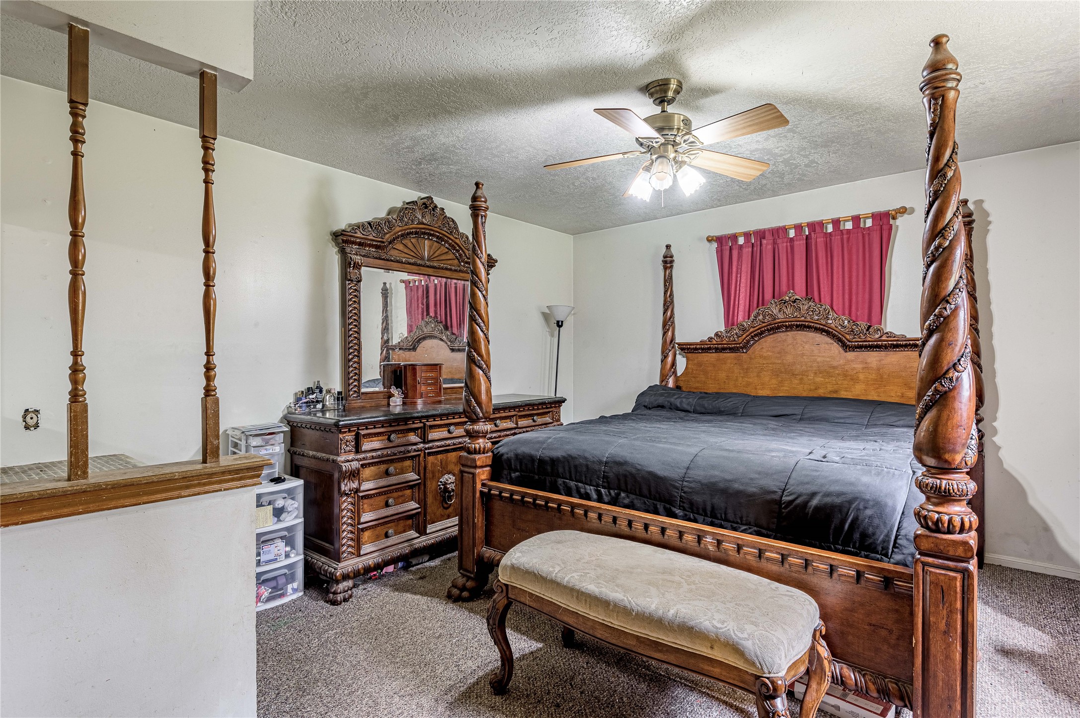 7640 Highway 75 Huntsville, TX 77340 - Photo 48 of 49 a bedroom with a bed and a chandelier