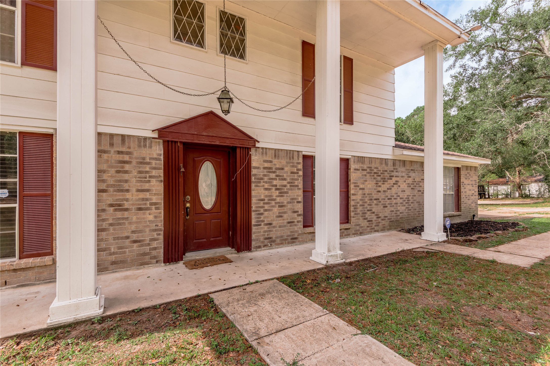 7640 Highway 75 Huntsville, TX 77340 - Photo 5 of 49 a front view of a house with garden