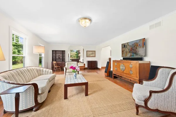 a living room with furniture and a large window