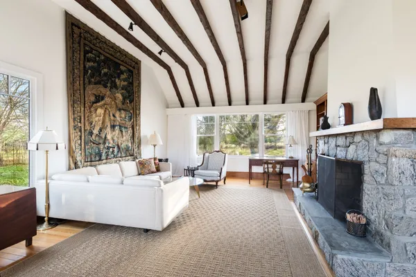 a living room with furniture and a fireplace