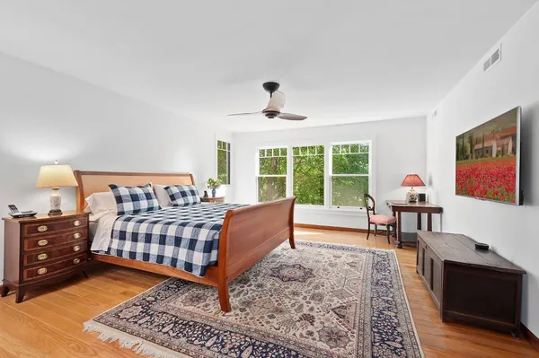 a bedroom with furniture and a window