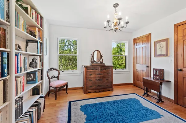 a living room with furniture and a rug
