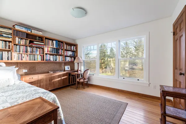 a reading room with furniture and a window