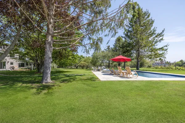 a view of a table and chairs in the garden