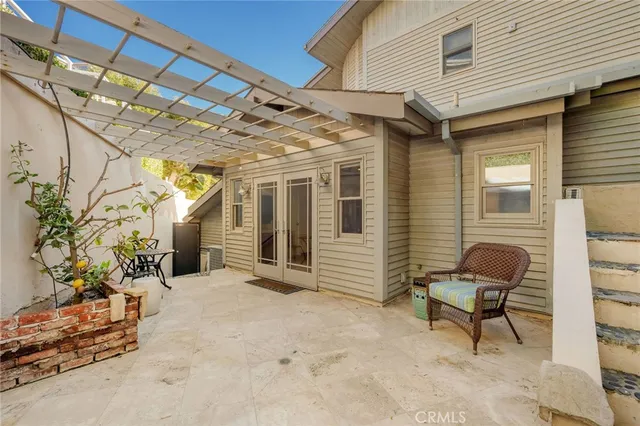 a view of a chair and table in the house