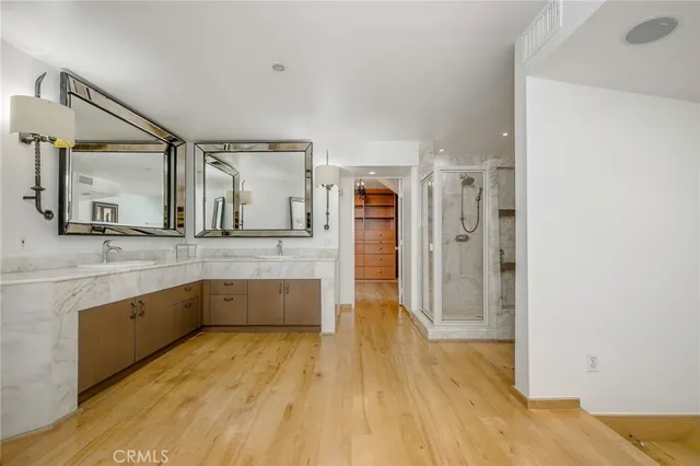 a large bathroom with a sink and mirror