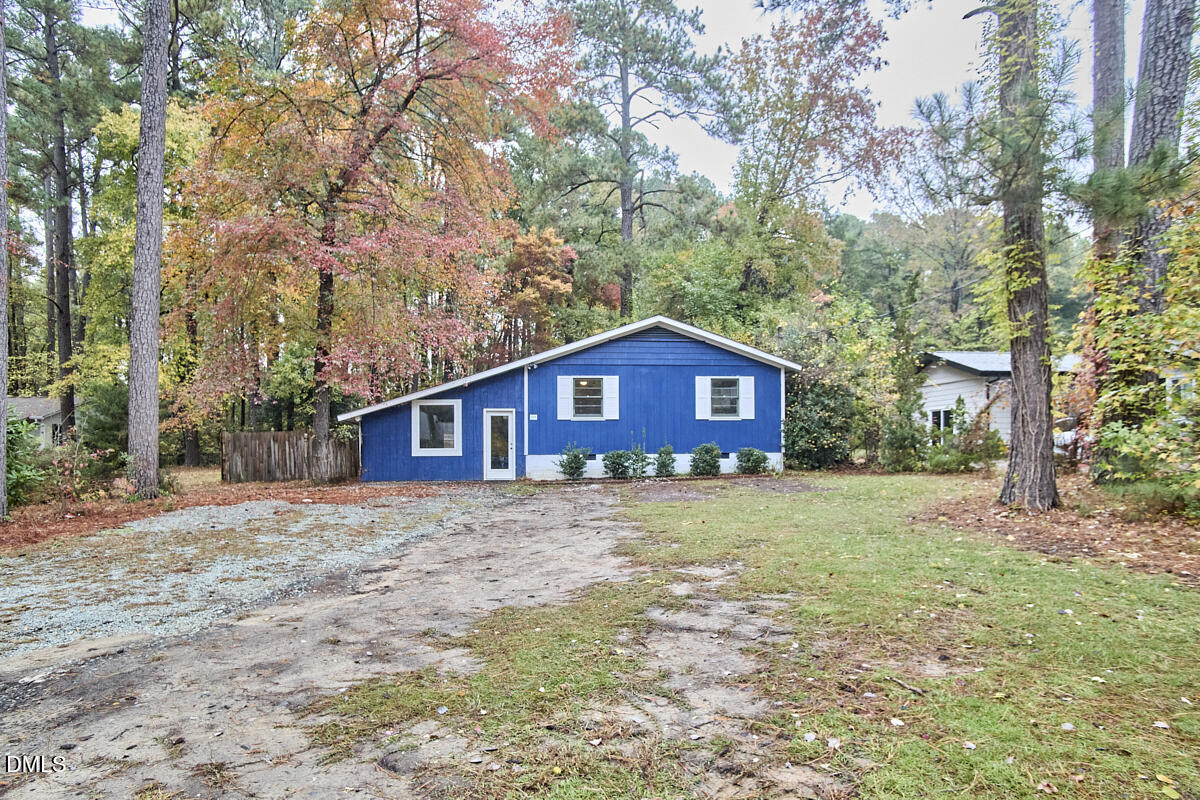 2128 Strebor Street Durham, NC 27705 - Photo 3 of 51 a view of a yard in front of a house with large trees