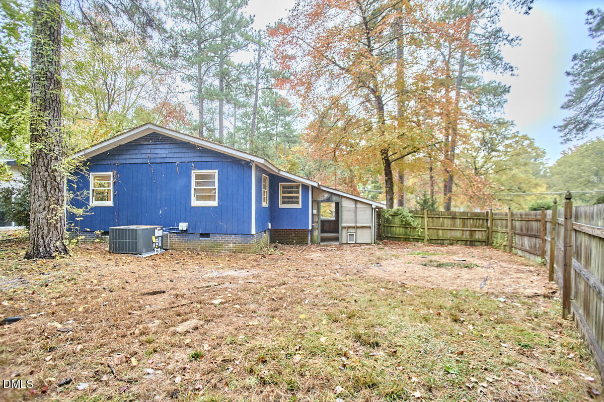 2128 Strebor Street Durham, NC 27705 - Photo 7 of 51 a brick house with a large tree in the middle of a yard